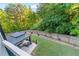 The large backyard with a lawn features a gazebo, landscaping, and a wooden fence at 2582 Corey Park Dr, Loganville, GA 30052