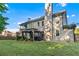 Expansive backyard featuring a gazebo, lush lawn, and mature trees at 2582 Corey Park Dr, Loganville, GA 30052