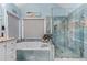 Bathroom boasting a separate soaking tub, tiled shower, and natural light at 2582 Corey Park Dr, Loganville, GA 30052