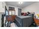 Bedroom featuring a dark color scheme, a queen size bed and two dressers at 2582 Corey Park Dr, Loganville, GA 30052