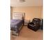 Cozy bedroom with bed, recliner, and nightstand on plush carpet at 2582 Corey Park Dr, Loganville, GA 30052