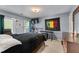 The bedroom has a queen bed, desk, tv, and a door to the back deck at 2582 Corey Park Dr, Loganville, GA 30052