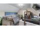 Cozy bonus room with comfortable seating, natural light, and a tv at 2582 Corey Park Dr, Loganville, GA 30052