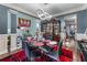 Elegant dining room with hardwood floors, stylish lighting, and sophisticated decor at 2582 Corey Park Dr, Loganville, GA 30052