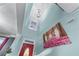 Light-filled entry featuring tall ceilings, a striking chandelier, and artwork at 2582 Corey Park Dr, Loganville, GA 30052