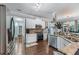 Bright kitchen with stainless steel appliances, granite countertops, and white cabinetry at 2582 Corey Park Dr, Loganville, GA 30052