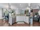 An open kitchen featuring granite countertops, white cabinets, and stainless steel appliances at 2582 Corey Park Dr, Loganville, GA 30052
