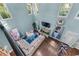 Open-concept living room with high ceilings, fireplace, and abundant natural light at 2582 Corey Park Dr, Loganville, GA 30052