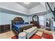 A beautifully appointed main bedroom with a tray ceiling and modern furnishings at 2582 Corey Park Dr, Loganville, GA 30052