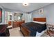 Comfortable bedroom with neutral walls, dark wood furniture, and an ensuite bathroom at 2582 Corey Park Dr, Loganville, GA 30052