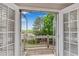 Shuttered balcony overlooking the lush yard and trees at 3110 Royal Troon, Woodstock, GA 30189