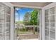 Private balcony featuring wooden railing and shutters overlooks lush green landscape at 3110 Royal Troon, Woodstock, GA 30189