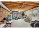 Unfinished basement offering potential with open layout, exposed wood, and natural light at 3110 Royal Troon, Woodstock, GA 30189