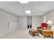 The basement features a chair, ottoman, lamp and ample space at 3110 Royal Troon, Woodstock, GA 30189