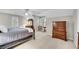 This bedroom features a ceiling fan, dresser and two windows providing natural light at 3110 Royal Troon, Woodstock, GA 30189