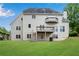 Back exterior view of home featuring decks and ample lawn space at 3110 Royal Troon, Woodstock, GA 30189