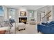 Cozy living room with fireplace and a light color scheme at 3110 Royal Troon, Woodstock, GA 30189