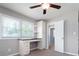 Comfortable bedroom with built in desk and cabinets and ample natural light, great for home office at 4284 Carlos Ct, Powder Springs, GA 30127