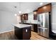 Updated kitchen with island, stainless steel appliances, and dark wood cabinetry at 4284 Carlos Ct, Powder Springs, GA 30127