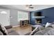 A cozy, well-lit living room with nice couch and fireplace at 4284 Carlos Ct, Powder Springs, GA 30127
