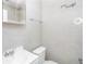 Bright bathroom with neutral tile, toilet, sink, mirror, and a motivational phrase on the wall at 432 Ira Sw St # 201, Atlanta, GA 30312