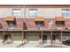 Townhome exterior with brick facade, awnings, balcony and attached garages, set in a row at 432 Ira Sw St # 201, Atlanta, GA 30312