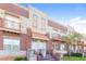 Attractive townhome row featuring brick facade, cozy balconies, and easy access with beautiful landscaping at 432 Ira Sw St # 201, Atlanta, GA 30312