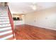 Spacious living room with gleaming hardwood floors, open layout to kitchen and adjacent staircase at 432 Ira Sw St # 201, Atlanta, GA 30312