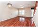 Bright living room featuring beautiful wood floors, modern lighting, and a view of the private entrance at 432 Ira Sw St # 201, Atlanta, GA 30312