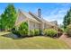 Well-maintained backyard with lush landscaping, mature trees, and a spacious deck at 625 Aunt Lucy Sw Ln # 61, Smyrna, GA 30082
