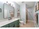Updated bathroom features a large mirror, neutral paint, and a convenient step-in shower at 625 Aunt Lucy Sw Ln # 61, Smyrna, GA 30082