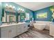 Stylish bathroom with double vanity, a freestanding tub and contemporary fixtures at 625 Aunt Lucy Sw Ln # 61, Smyrna, GA 30082
