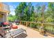 Outdoor deck is perfect for outdoor entertainment with a seating area, grill, and wooded view at 625 Aunt Lucy Sw Ln # 61, Smyrna, GA 30082
