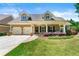 Charming single-Gathering home featuring a manicured lawn, inviting front porch, and two-car garage at 625 Aunt Lucy Sw Ln # 61, Smyrna, GA 30082