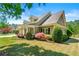 Beautiful home exterior featuring manicured lawns, mature trees and excellent curb appeal at 625 Aunt Lucy Sw Ln # 61, Smyrna, GA 30082