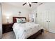Comfortable bedroom with a ceiling fan, and an ensuite bathroom at 715 Aronson Lake Ct, Roswell, GA 30075