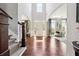 Grand foyer with soaring ceilings, gleaming hardwood floors, and abundant natural light at 715 Aronson Lake Ct, Roswell, GA 30075