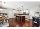 Spacious kitchen with granite island, stainless appliances, and hardwood floors at 715 Aronson Lake Ct, Roswell, GA 30075