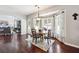 Eat-in kitchen with hardwood floors, a breakfast table, and access to the living room at 715 Aronson Lake Ct, Roswell, GA 30075