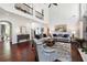Open living room featuring hardwood floors, high ceilings, and large windows at 715 Aronson Lake Ct, Roswell, GA 30075