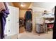 Spacious walk-in closet with custom shelving and racks for clothes and shoes at 715 Aronson Lake Ct, Roswell, GA 30075