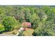 Aerial view of the house with a large private lot and beautiful mature trees at 1423 Fairfield Sw Dr, Lilburn, GA 30047