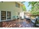The back deck features a furniture set and a set of french doors to go inside at 1423 Fairfield Sw Dr, Lilburn, GA 30047