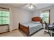 Bedroom with carpeting and view out the window at 1423 Fairfield Sw Dr, Lilburn, GA 30047