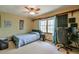 Bedroom featuring light-colored walls, a ceiling fan, carpeting, and ample natural light at 1423 Fairfield Sw Dr, Lilburn, GA 30047