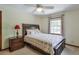 This bedroom features a ceiling fan, carpet, one window and neutral color walls at 1423 Fairfield Sw Dr, Lilburn, GA 30047
