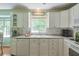 Bright kitchen with white cabinets, laminate countertops, and modern appliances; a classic, functional design at 1423 Fairfield Sw Dr, Lilburn, GA 30047