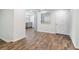 Basement area featuring wood-look floors and bar with cabinets and open shelves at 160 Oglesby Bridge Rd, Conyers, GA 30094