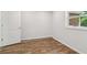 Bright bedroom features wood-look floors and a view of the exterior at 160 Oglesby Bridge Rd, Conyers, GA 30094