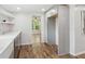 Kitchen boasts gray cabinetry, white countertop, and open shelving near connected room at 160 Oglesby Bridge Rd, Conyers, GA 30094